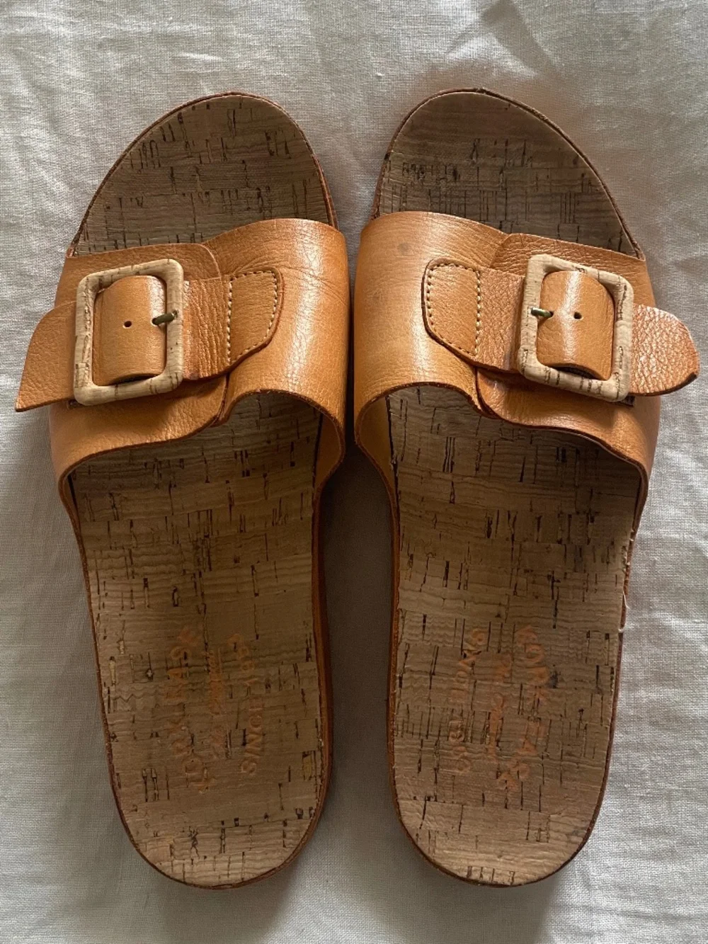 Kork-Ease Tutsi tan buckle slide sandals with natural cork buckle and footbed